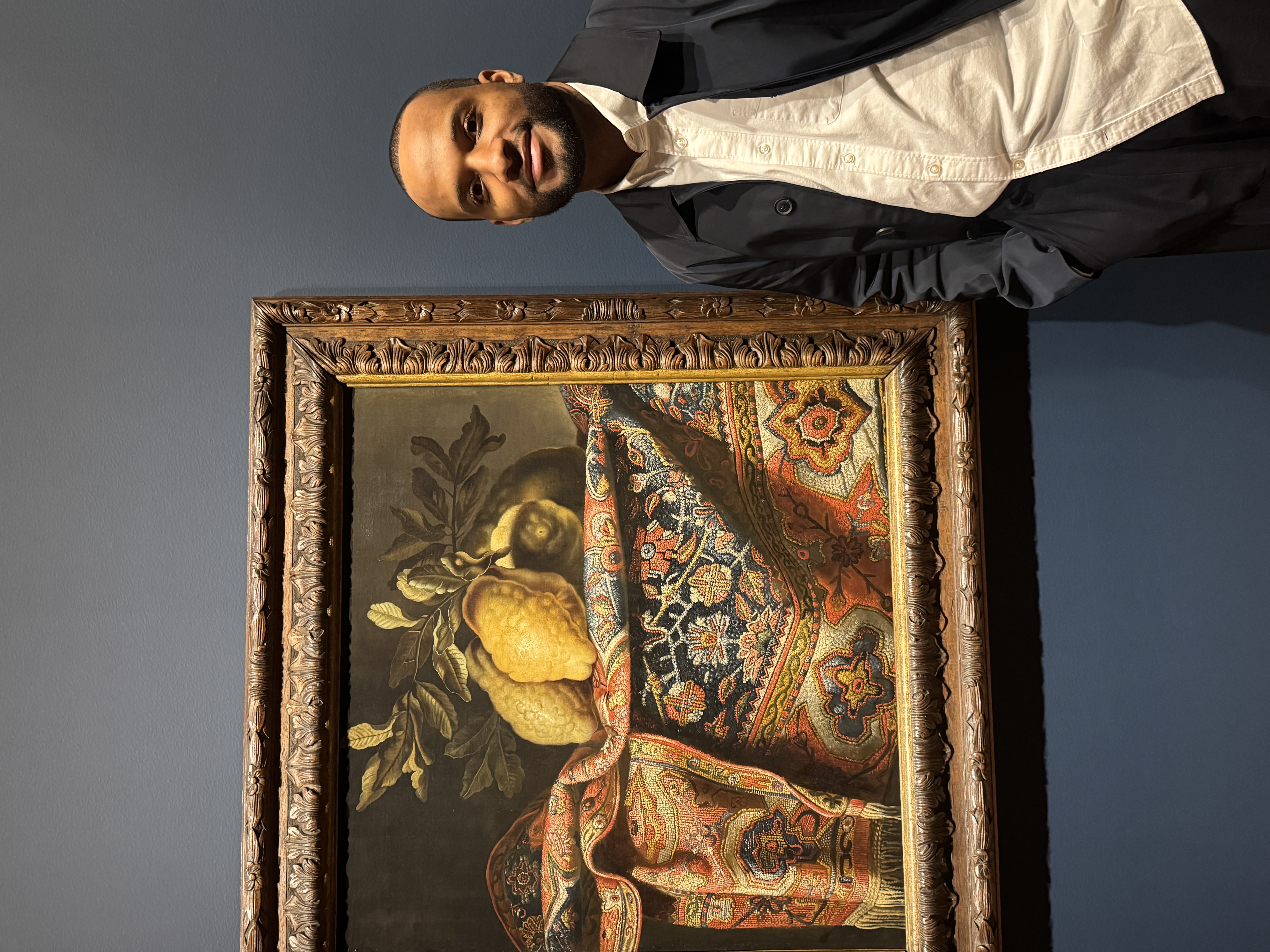Image of student in front of a painting